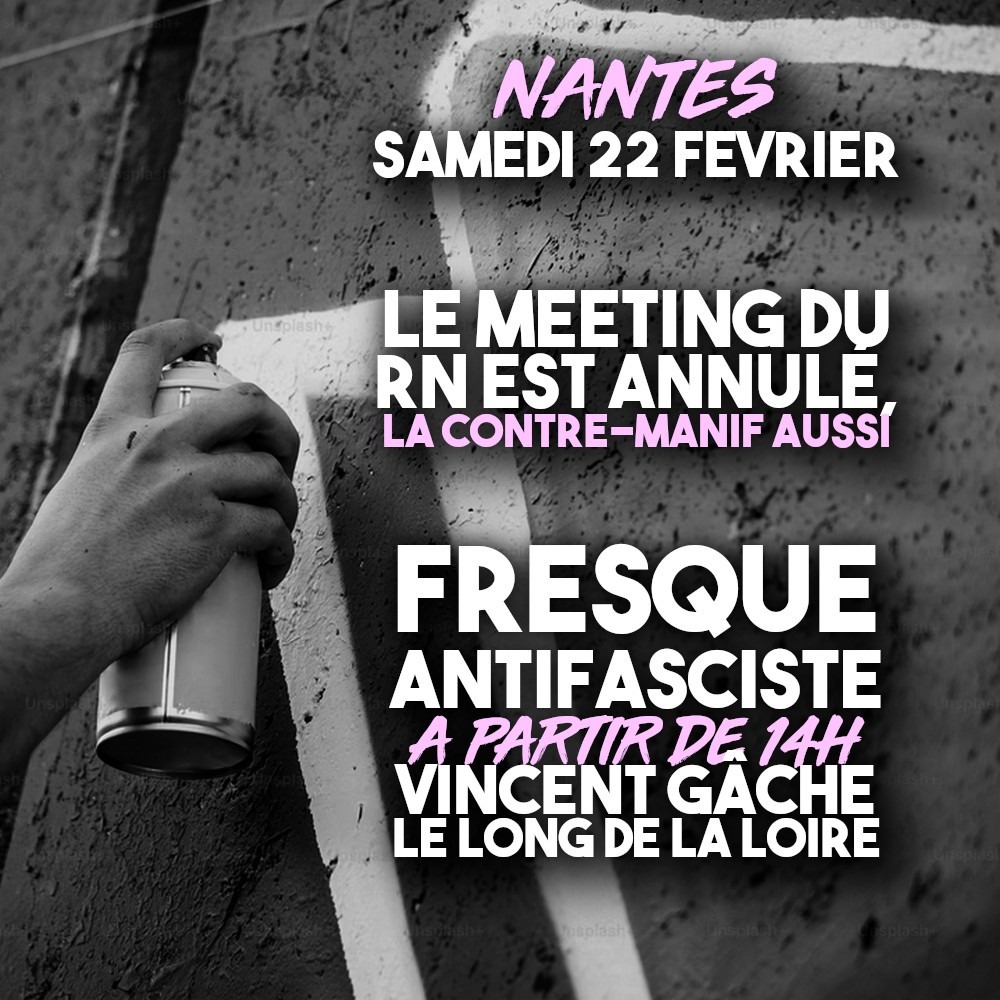 Une main tient une bombe de peinture et réalise une fresque antifasciste.