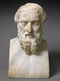 A marble bust of a bearded man with name Herodotus inscribed in Greek at the base