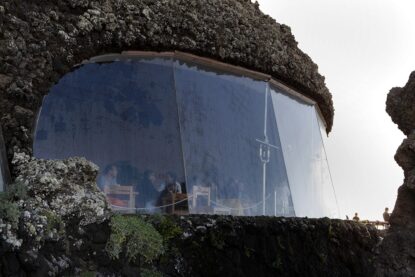 Low angle view of viewing window, Mirador del Rio, Lanzarote, Canary Islands, Spain, pictured on November 26, 2010 in the evening. Mirador, Spanish for lookout, is at the coastal end of the Risco de Famara mountains. In the 16th century Spanish settlers watched for pirates, and in 1898, during the Spanish American War, a fortress was built here. In 1974 local artist Cesar Manrique (1919-92), with architects Jesus Soto and Eduardo Caceres, designed a restaurant for the Mirador. A room was quarried from the cliff, roofed by two cupolas. Lanzarote, the Easternmost of the Canary Islands, lies 125km East of the African coast, in the Atlantic Ocean. Like the other islands in this autonomous Spanish archipelago, Lanzarote is originally Volcanic. Picture by Manuel Cohen.